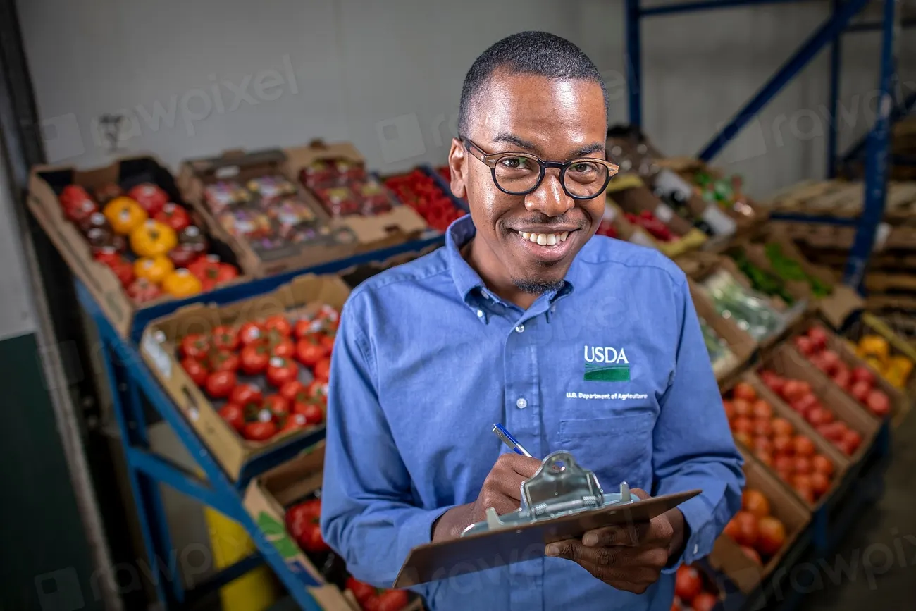 A small business owner in his shop with a tablet