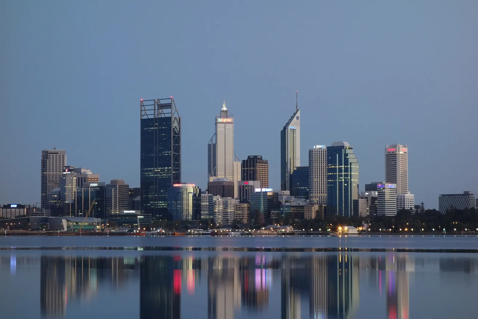 The Perth city skyline across the water at dusk
